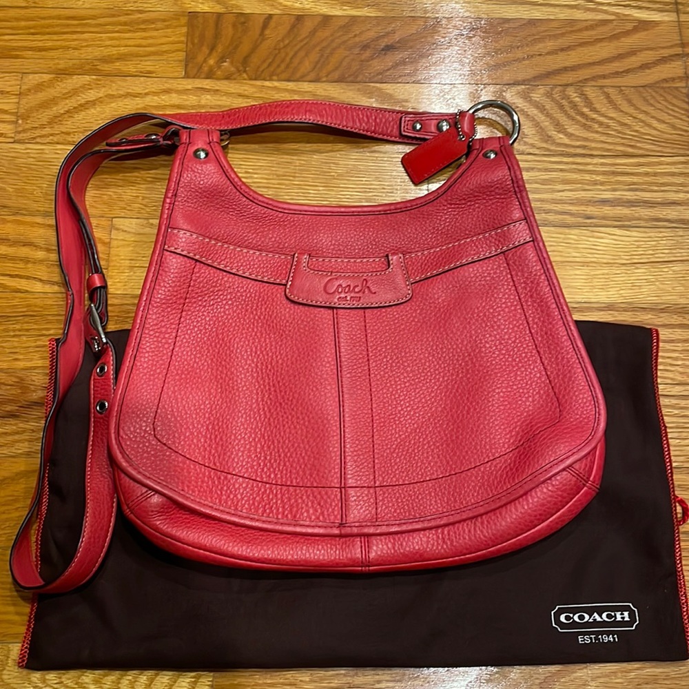 Coach front flap crossbody bag. Back zipper pocket. Adjustable strap.